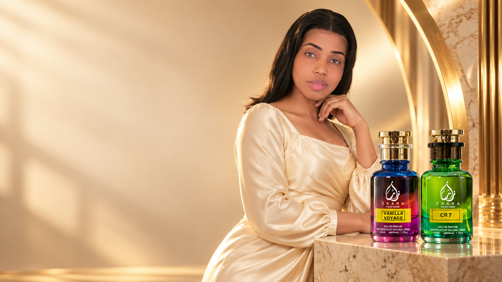 Debo in ivory satin beside Zaara Vanilla Voyage and CR7 perfume bottles